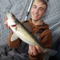 George Wells Fishing Trips Fisherman with Walleye